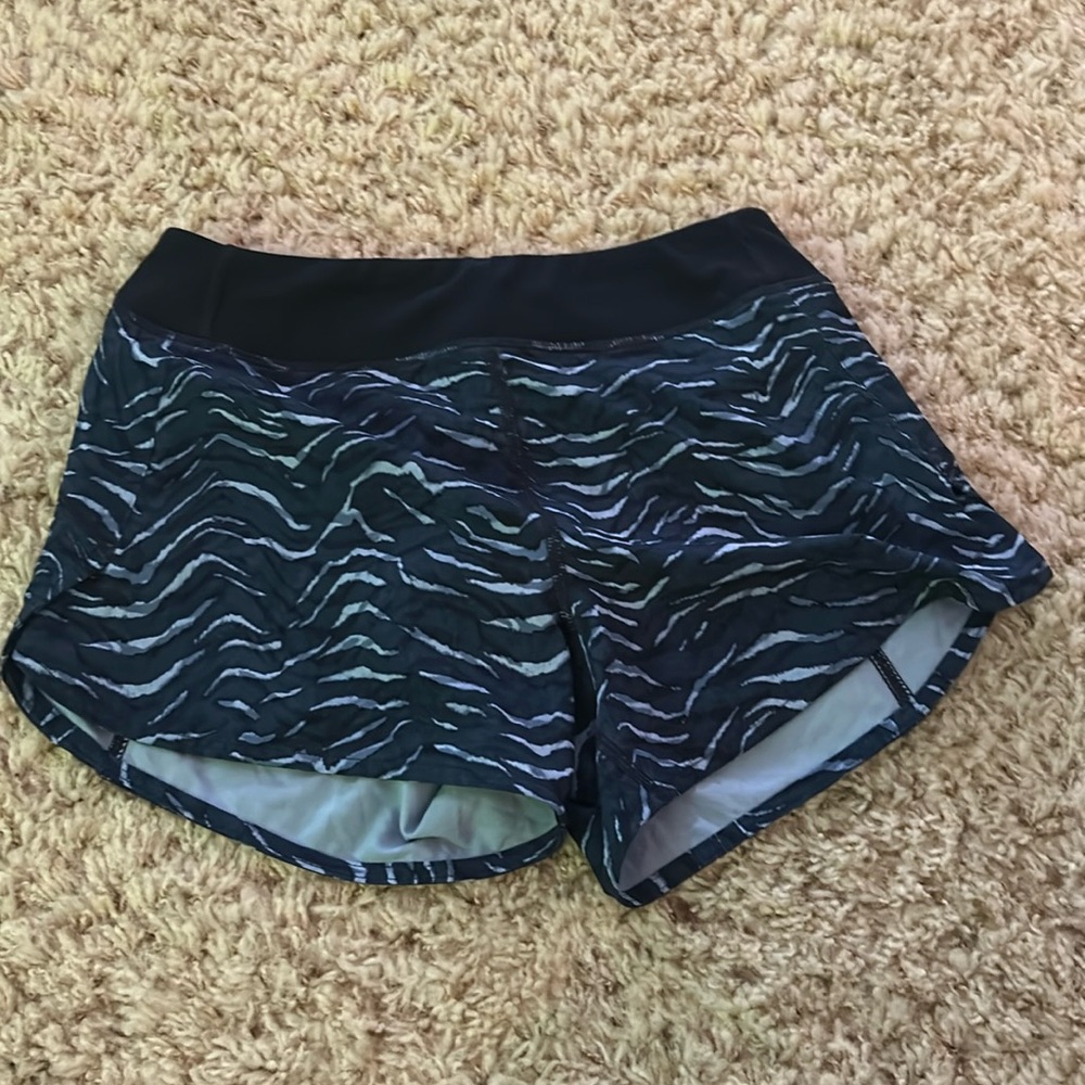 Athleta Girl active shorts, elastic waste, navy, white, and blue swirl pattern